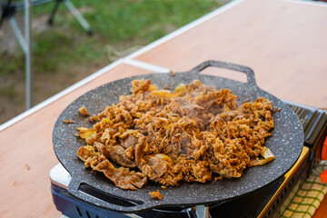 Cook beef slices in a flat skillet, pan