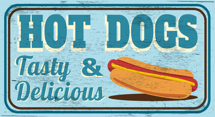 Tasty and delicious hot dogs vintage sign on wood