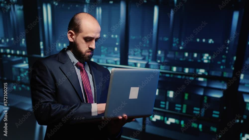Poster it server engineer inspecting working computer processor with laptop, standing in professional data 