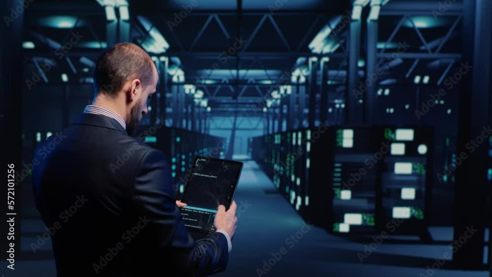 Poster datacenter engineer inspecting working server computers with web information on tablet, future digit