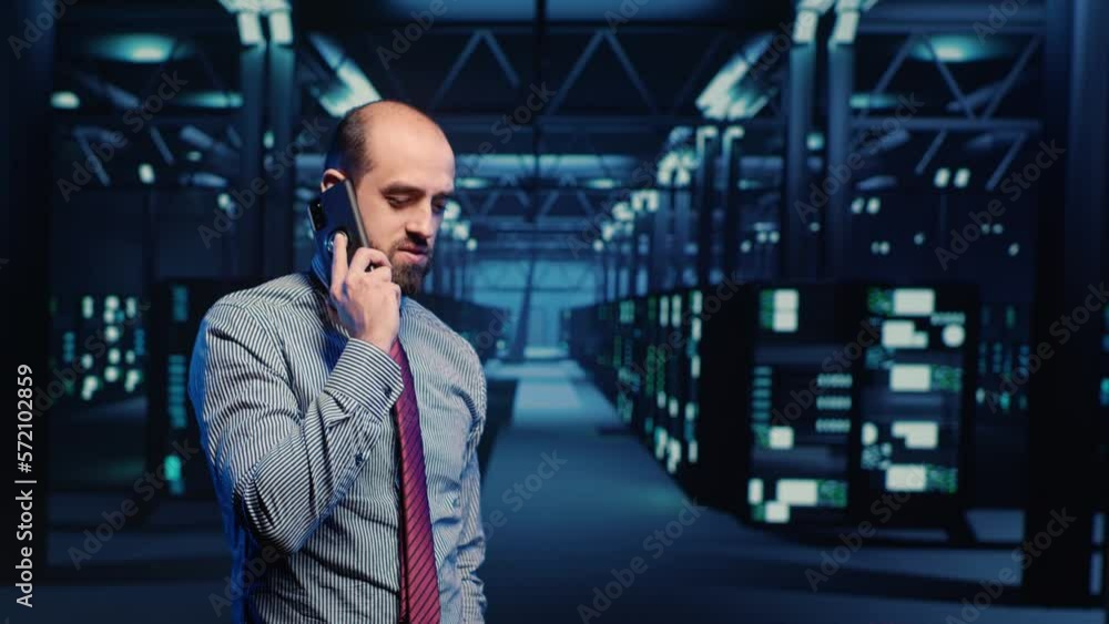 Poster information security officer talking on phone call, working in professional data center with big dat