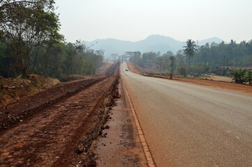 Naklejka premium road construction into the forest