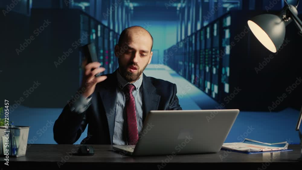 Poster information security officer answering phone call in server room, using big data and hardware for cl