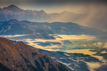 Hohe Tauern mountains and lake from above Grossglockner road at dawn, Austria