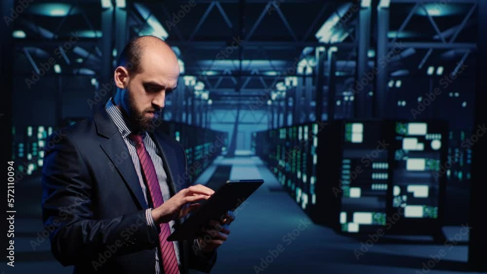 Poster it engineer using tablet in high tech server room, planning networking computer system. database adm