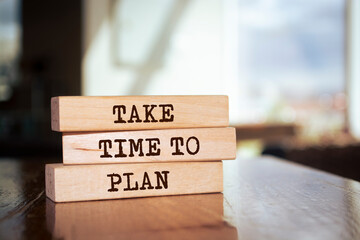 Wooden blocks with words 'Take time to plan'. Business concept