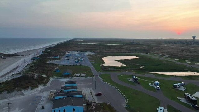 Aerial View Of Padre Balli Park Near Bob Hall Pier At Dusk In Corpus Christi, Texas, USA. pullback