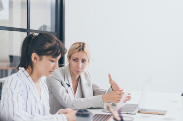 Obraz premium Businesswomen sharing ideas and working a new project in office,Business teamwork concept