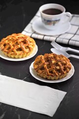 Tea time with apple pie on back marble table