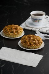 Tea time with apple pie on back marble table