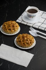 Tea time with apple pie on back marble table