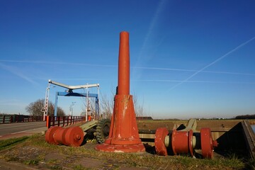 Drawbridge at Dinteloord in the Netherlands. Connection between landscapes and shipping passing point. Opens by counterweight and closes with hinge movement for traffic flow.