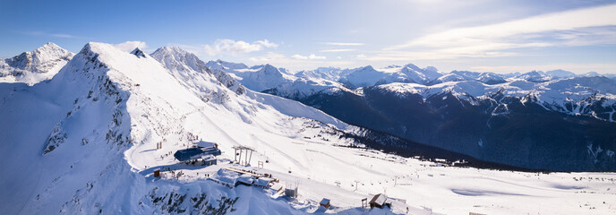 Peak of Blackcomb, 7th Heaven chairlift, aerial drone footage ski hill on a sunny day, Whistler BC,...