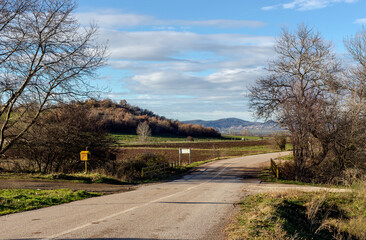 Rural road in the mountains in the winter, sunny day (Greece)
