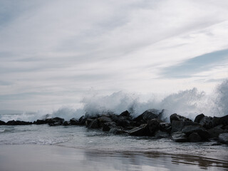 waves breaking on jetty