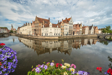 Fototapeta na wymiar Bruges Belgium, city skyline at Spiegelrei Canal with summer flower