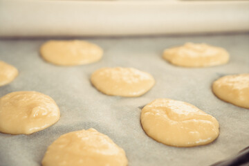 circles of dough on a baking sheet
