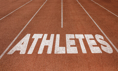Fototapeta na wymiar Athletes written on running track, New Concept on running track text in white color