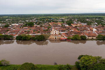 Fototapeta na wymiar Aerial view from a drone of the town of Santa Cruz de Mompox facing the Magdalena river. Colombia