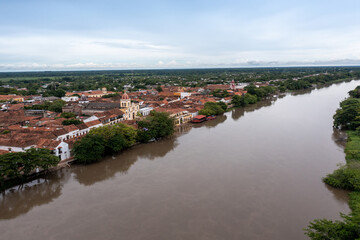 Obraz premium View from a drone of the Magdalena river with the town of Santa Cruz de Mompox in the background. Colombia.