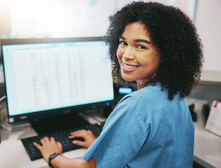 Portrait, nurse and receptionist at hospital on a computer working at her desk or table in an...