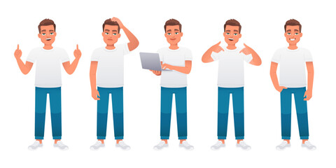 Obraz premium The guy stands radiating confidence, thoughtfully, with a laptop in his hands, points to something. A young caucasian male in a white t-shirt and blue jeans stands in various poses. 