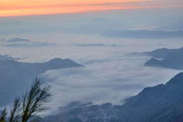 Fog in early morning over the mountain at Phu Chi Fah in Thailand