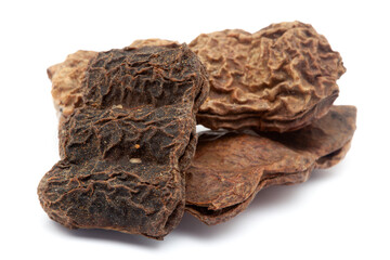 Closeup of Dry Shikakai (Acacia concinna) fruits, isolated on white background.