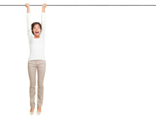 woman hanging with hands on a pole or bar. Funny image of shocked looking female model isolated cutout PNG on transparent background. - obrazy, fototapety, plakaty