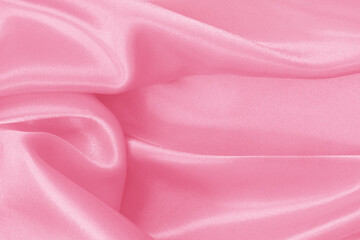 Soft pink fabric texture background, detail of silk or linen pattern.