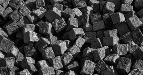 cobblestones arranged in a pile,black and white background,