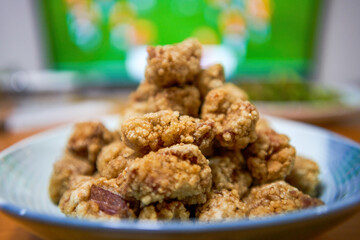 A plate of crispy and delicious fried crispy meat close-up