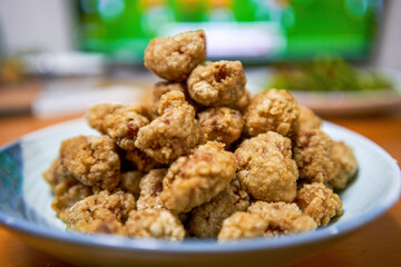 A plate of crispy and delicious fried crispy meat close-up