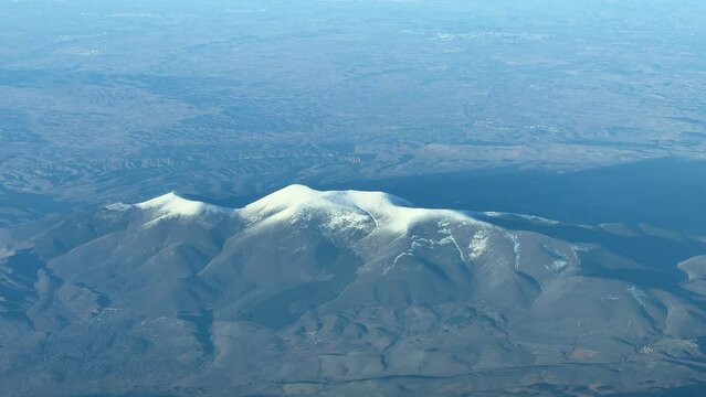 Aerial view of El Moncayo mountain in Zaragoza, Spain. Recorded from a jet cockpit at 12000m high