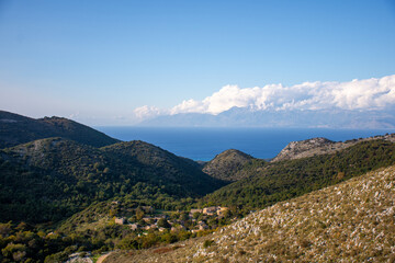 Fototapeta na wymiar View of the oldest village of Corfu island, close to Mount Pantokrator, abandoned village of Sinies Old Perithia. Greece.