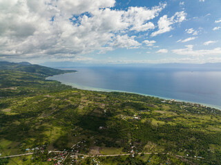 Fototapeta na wymiar Aerial drone of coastline of the island of Cebu against the backdrop of the blue sea and the island of Negros. Philippines.