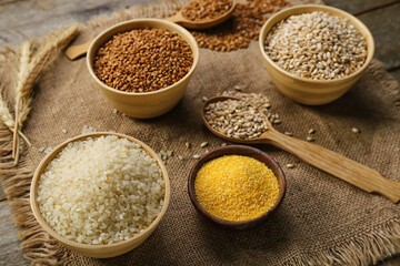 Bowls of different cereals on sack napkin