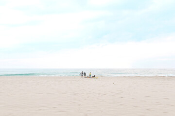 Beach in Hawaii A group to enjoy surfing in a secluded sea with few people