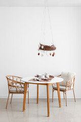 Stylish interior of dining room with beautiful Easter decor