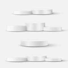 Set of white cylinder pedestal podium, isolated.
