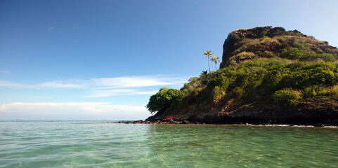 Mokolii island [also known as Chinamans Hat] as seen from the water on the North Shore of Oahu...