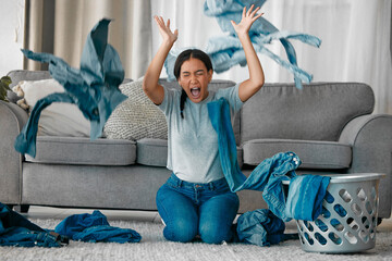Laundry, angry and woman with clothes in air frustrated from cleaning, housekeeping and housework. Burnout, washing basket and upset, stressed and shouting female maid in living room throw clothing - Powered by Adobe