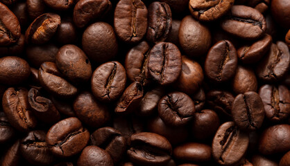 Grains of black coffee as a background.