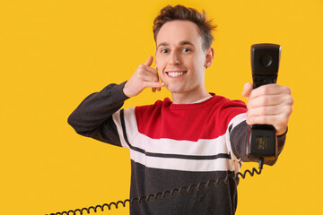 Cool young man with receiver showing 