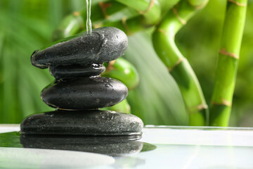 Stack of spa stones in water outdoors