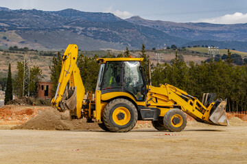 yellow excavator at work
