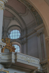 Magnificent opulent splendid Bavarian baroque church cathedral basilica interiors with stucco, murals, altar, Pilars, ceiling paintings, gold, wood domes nave