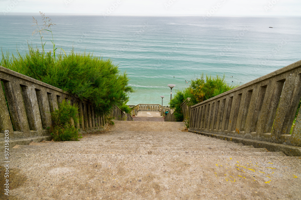 Wall mural stone staircase access to sea beach in Biarritz coast Atlantic southwest ocean in france