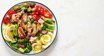 Tuna salad with lettuce, eggs and tomatoes.