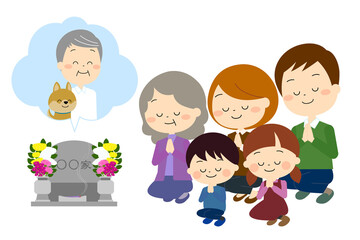おじいさんとペットのお墓参りをする家族（秋冬）